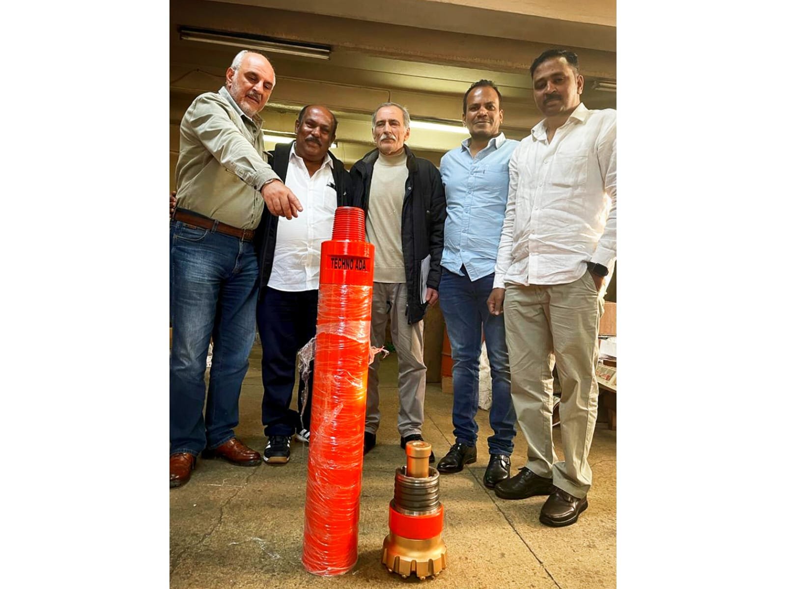 Alpha Drilling Associates team with drilling equipment